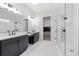 Elegant bathroom with double vanity, walk-in shower, and walk-in closet at 3750 Montebello Pkwy, Cumming, GA 30028