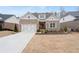 Beautiful brick home with two-car garage, landscaped front yard, and welcoming curb appeal at 3750 Montebello Pkwy, Cumming, GA 30028