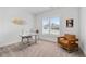 Well-lit home office with a neutral color scheme, large window, and comfortable seating at 3750 Montebello Pkwy, Cumming, GA 30028