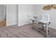 Bright office with a neutral color scheme, desk, and comfortable seating near closet at 3750 Montebello Pkwy, Cumming, GA 30028