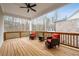 Covered porch features a ceiling fan, and comfortable seating for outdoor enjoyment at 3750 Montebello Pkwy, Cumming, GA 30028