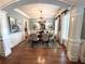 Formal dining room featuring a chandelier, wainscoting, and windows with white shutters at 962 Manor Parc Dr, Decatur, GA 30033