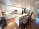 Bright kitchen features granite countertops, stainless steel appliances, and island with seating at 962 Manor Parc Dr, Decatur, GA 30033