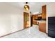 Corner of the kitchen, showing cabinets, tile floor, lighting and appliances at 1350 Piedmont Rd, Marietta, GA 30066