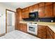 Kitchen area shows cabinets, countertops, and appliances including oven and microwave at 1350 Piedmont Rd, Marietta, GA 30066