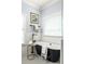 A luxurious bathroom boasts a modern black soaking tub with white subway tile and neutral walls at 1602 Windsor Walk, Avondale Estates, GA 30002