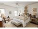 A serene bedroom features a plush bed, neutral decor, and ample natural light, creating a relaxing retreat at 1602 Windsor Walk, Avondale Estates, GA 30002