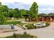 Community park with walking path, landscaped garden, fountain, and shaded seating areas at 1602 Windsor Walk, Avondale Estates, GA 30002