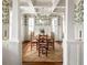 Elegant dining room with coffered ceiling, chandelier, and large windows for ample light at 1602 Windsor Walk, Avondale Estates, GA 30002