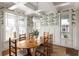 Charming dining room featuring designer wallpaper, a chandelier, and lots of natural light at 1602 Windsor Walk, Avondale Estates, GA 30002