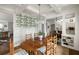 Dining room with elegant light fixture, adjacent to kitchen and entryway at 1602 Windsor Walk, Avondale Estates, GA 30002