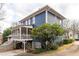 Two-story home boasts a screened porch and well-maintained landscaping at 1602 Windsor Walk, Avondale Estates, GA 30002