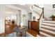 Inviting foyer with hardwood floors and a staircase, leading to a cozy living room at 1602 Windsor Walk, Avondale Estates, GA 30002