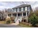 Beautiful two-story home with a full front porch and well-maintained landscaping at 1602 Windsor Walk, Avondale Estates, GA 30002