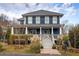 Charming two-story home with a welcoming front porch and beautifully landscaped yard at 1602 Windsor Walk, Avondale Estates, GA 30002