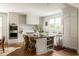 Spacious kitchen with stainless steel appliances, island with seating, and white cabinetry at 1602 Windsor Walk, Avondale Estates, GA 30002