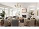 Bright living room with large windows and neutral decor at 1602 Windsor Walk, Avondale Estates, GA 30002