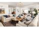 Open concept living room flowing into the kitchen and dining area at 1602 Windsor Walk, Avondale Estates, GA 30002