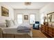 Serene bedroom featuring neutral tones, natural light, and stylish furniture at 1602 Windsor Walk, Avondale Estates, GA 30002