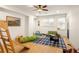 Spacious playroom features a ceiling fan, bright windows, and plenty of room for activities at 1602 Windsor Walk, Avondale Estates, GA 30002