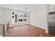 Dining area featuring hardwood floors, modern chandelier, and ample natural light at 3462 Dryden Se Ln, Vinings, GA 30339