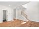 Bright and airy living room featuring hardwood floors and staircase at 3462 Dryden Se Ln, Vinings, GA 30339