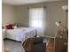 Bright bedroom with a comfortable bed, soft linens, and natural light, creating a peaceful retreat at 4033 Louise St, Powder Springs, GA 30127