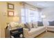 Comfortable living room with a neutral palette, soft lighting, and stylish decor, ideal for entertaining at 4033 Louise St, Powder Springs, GA 30127