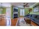 Bright living room with hardwood floors, a fireplace, and a comfortable seating area at 4779 Longcourt Dr # 21, Atlanta, GA 30339