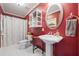 Bathroom featuring a pedestal sink, oval mirror, and a shower with a white curtain at 1650 Old Loganville Rd, Loganville, GA 30052