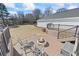 Large deck with firepit, providing a great space for outdoor gatherings and relaxation at 1650 Old Loganville Rd, Loganville, GA 30052