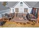 Multi-level deck featuring a built-in fire pit, outdoor seating, and a barbecue grill at 1650 Old Loganville Rd, Loganville, GA 30052