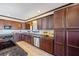 Kitchen with stainless steel appliances, granite countertops, and dark wood cabinetry provides ample storage at 1650 Old Loganville Rd, Loganville, GA 30052