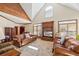 Bright living room with vaulted ceiling, wood accents, and built in entertainment center at 1650 Old Loganville Rd, Loganville, GA 30052
