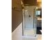 Newly renovated shower with glass door and herringbone tile at 1650 Old Loganville Rd, Loganville, GA 30052