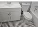 Bathroom featuring a white vanity, toilet, and black and white mosaic tile floor at 1666 Hearthstone Way, Jonesboro, GA 30236