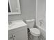 Bathroom featuring a white vanity, toilet, and tub with shower, plus black and white mosaic tile at 1666 Hearthstone Way, Jonesboro, GA 30236