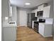 Updated kitchen with new cabinets, stainless steel appliances, and modern fixtures at 1666 Hearthstone Way, Jonesboro, GA 30236