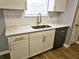 Bright kitchen featuring white cabinets, quartz countertops, and stainless steel appliances at 1666 Hearthstone Way, Jonesboro, GA 30236