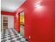 Basement corridor features bright walls and a diamond pattern floor leading to the basement at 1000 Eddie Craig Dr, Mcdonough, GA 30252