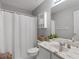 Cozy bathroom featuring a walk-in shower and a marble sink at 1000 Eddie Craig Dr, Mcdonough, GA 30252