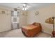 Neutral bedroom featuring carpet floors, decorative shelves, and a ceiling fan at 1000 Eddie Craig Dr, Mcdonough, GA 30252
