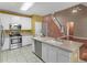 Kitchen with stainless steel appliances, island with sink, and hardwood floors at 1000 Eddie Craig Dr, Mcdonough, GA 30252