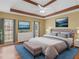 Serene main bedroom with a tray ceiling, plush bedding, and ample natural light at 1000 Eddie Craig Dr, Mcdonough, GA 30252
