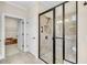 Bathroom features a glass enclosed shower with neutral tile and matte black hardware at 117 Clover Way, Woodstock, GA 30188