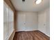 Bedroom featuring hardwood floors, natural light, and closet space for easy organization at 1211 Brookstone Rd, Atlanta, GA 30349