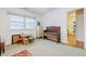 Well-lit bedroom with a toy desk, stools, and hardwood floors at 3900 Brenton Ne Way, Brookhaven, GA 30319