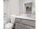Well-lit bathroom with grey vanity, tile floors and a shower with glass door at 4220 Cavalier Way, Duluth, GA 30097