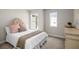 Cozy bedroom featuring a bed with plush pillows and natural light from two windows at 4220 Cavalier Way, Duluth, GA 30097