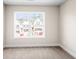 Bright bedroom with a large window overlooking new home construction at 4220 Cavalier Way, Duluth, GA 30097
